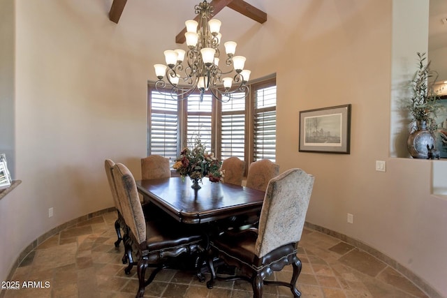 35195 N 98th St Unit 85, Scottsdale, AZ 85262 - dining space with a chandelier, stone tile floors, a towering ceiling, and baseboards
