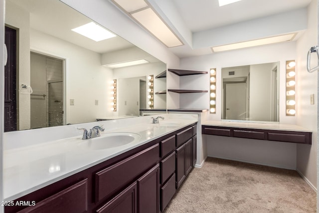 full bathroom with double vanity, baseboards, and a sink