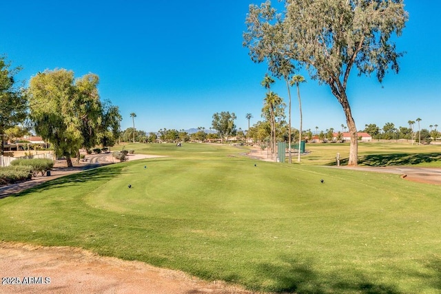 surrounding community with view of golf course