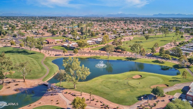 aerial view with a water and mountain view and golf course view