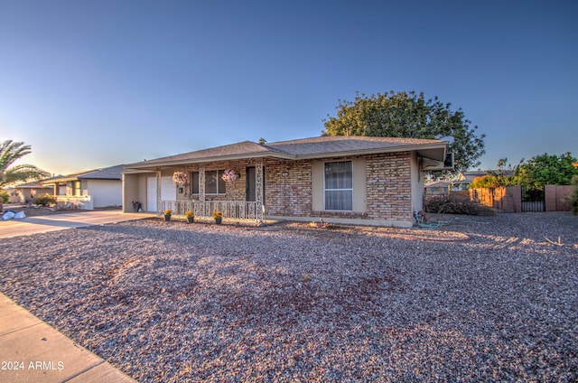 ranch-style home featuring a garage