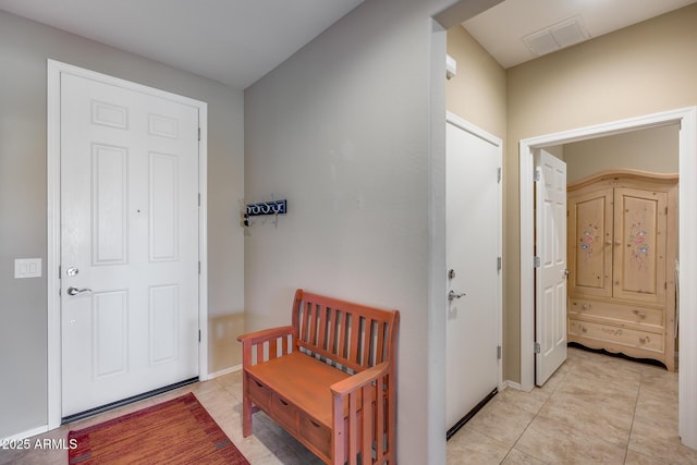 hallway with light tile patterned floors