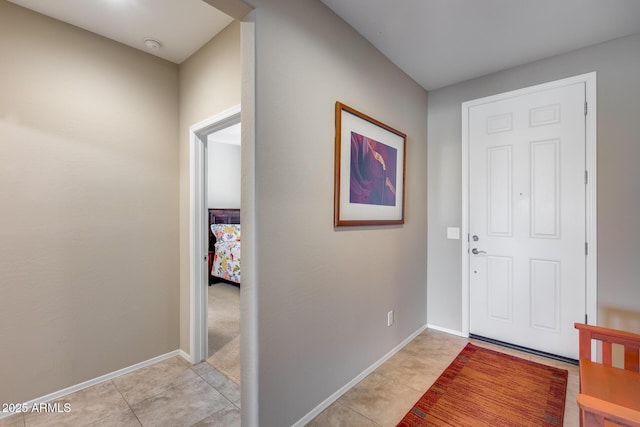 foyer with light tile patterned floors