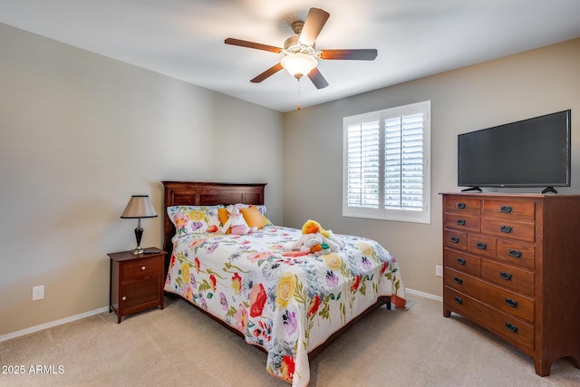 bedroom with light colored carpet and ceiling fan