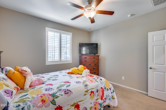 bedroom featuring light colored carpet and ceiling fan