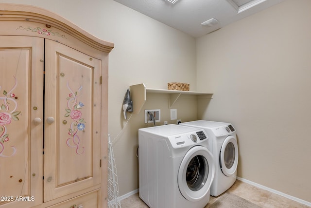 laundry room with washer and dryer