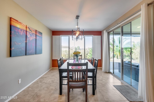 tiled dining space with a notable chandelier