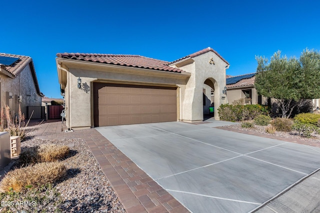 mediterranean / spanish-style home featuring a garage