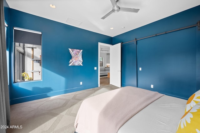 bedroom featuring light carpet and ceiling fan