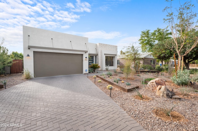 adobe home featuring a garage