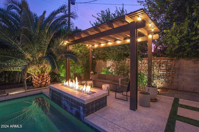 view of patio / terrace featuring a pergola, a fenced in pool, and an outdoor living space with a fire pit