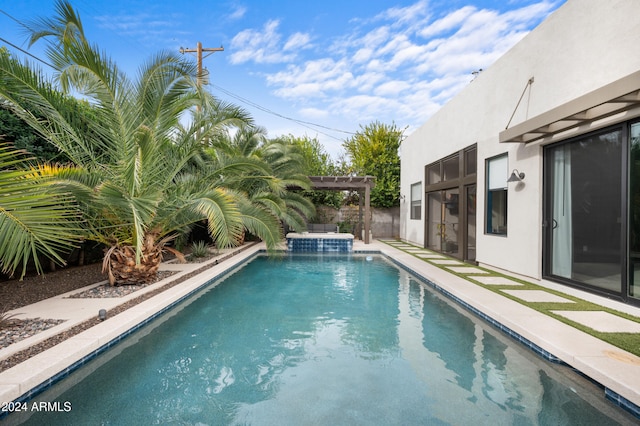 view of swimming pool featuring a pergola and an in ground hot tub