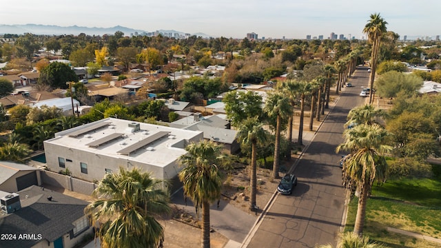 birds eye view of property with a mountain view