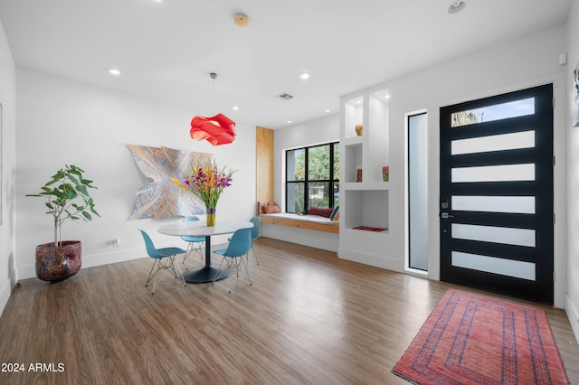 unfurnished dining area with hardwood / wood-style floors