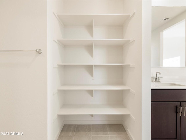 bathroom featuring vanity and tile patterned flooring