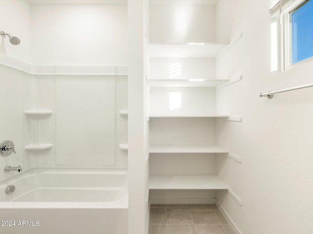 bathroom with shower / bath combination and tile patterned floors