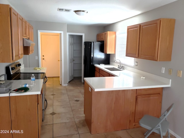 kitchen featuring black refrigerator, kitchen peninsula, sink, light tile patterned flooring, and stainless steel electric stove