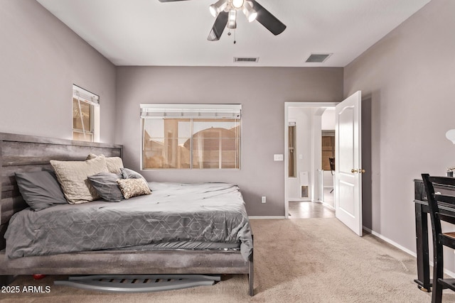 carpeted bedroom featuring visible vents, a ceiling fan, and baseboards