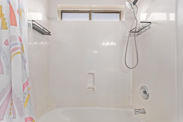 bathroom with shower / bathtub combination with curtain