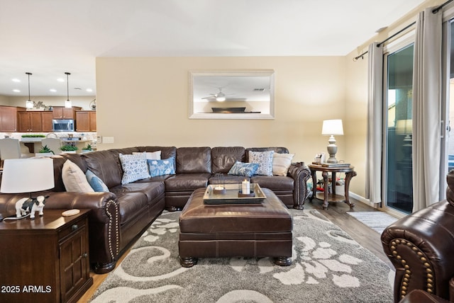 living room featuring recessed lighting, visible vents, and light wood-style floors