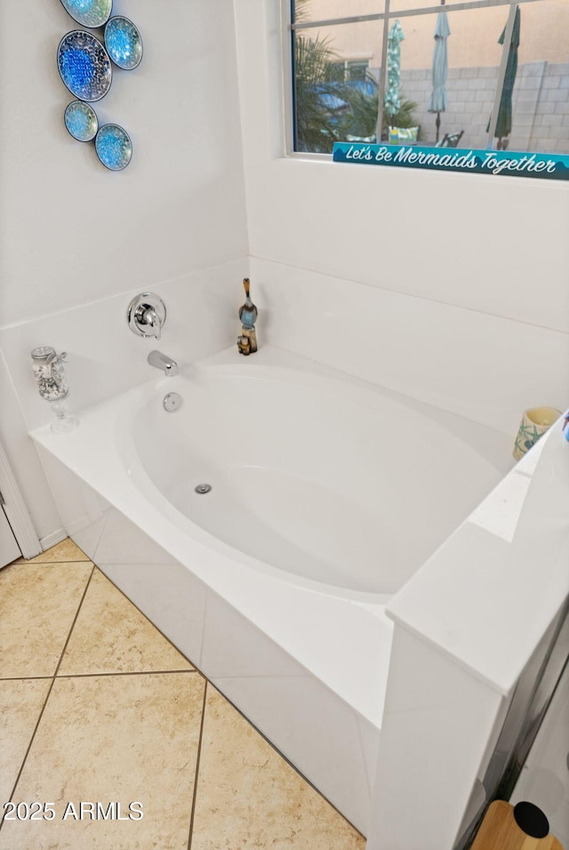 bathroom featuring a bath and tile patterned floors