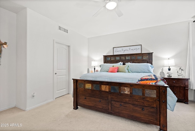 bedroom with light carpet, ceiling fan, visible vents, and baseboards