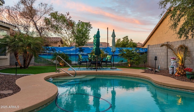 view of pool with a patio, a fenced backyard, and a fenced in pool