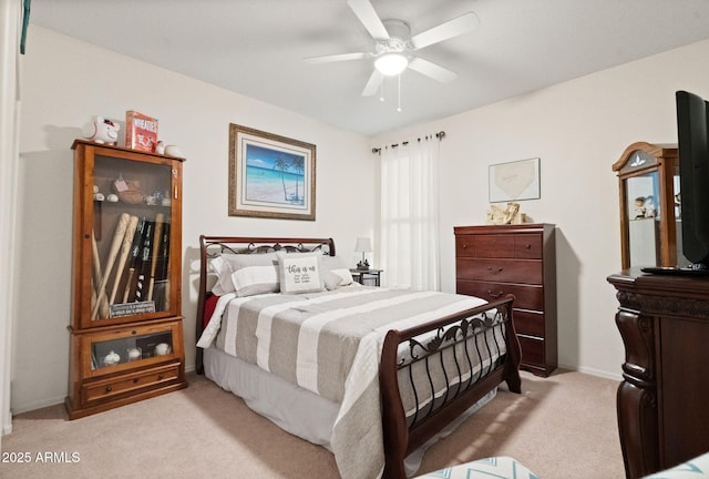 bedroom featuring a ceiling fan and light carpet