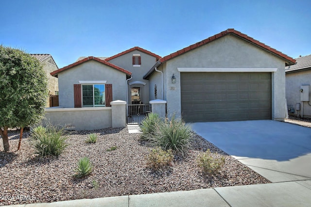 mediterranean / spanish-style home featuring a garage