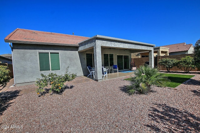 rear view of house featuring a patio