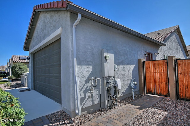 view of side of property featuring a garage