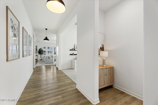 hallway with dark hardwood / wood-style floors