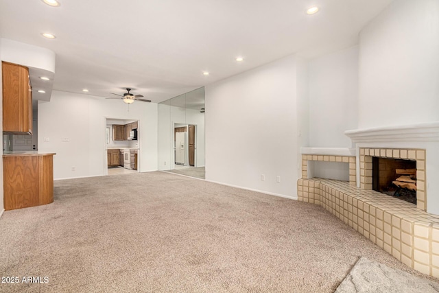 5200 S Lakeshore Dr Unit 206, Tempe, AZ 85283 - unfurnished living room featuring a ceiling fan, recessed lighting, carpet, a fireplace with raised hearth, and baseboards