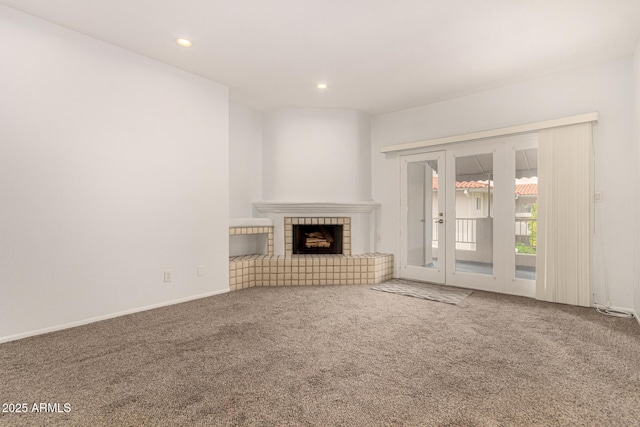 5200 S Lakeshore Dr Unit 206, Tempe, AZ 85283 - unfurnished living room featuring carpet floors, french doors, recessed lighting, a fireplace, and baseboards