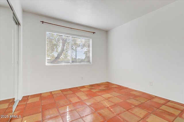 view of tiled spare room