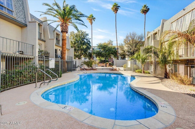 view of swimming pool with a patio