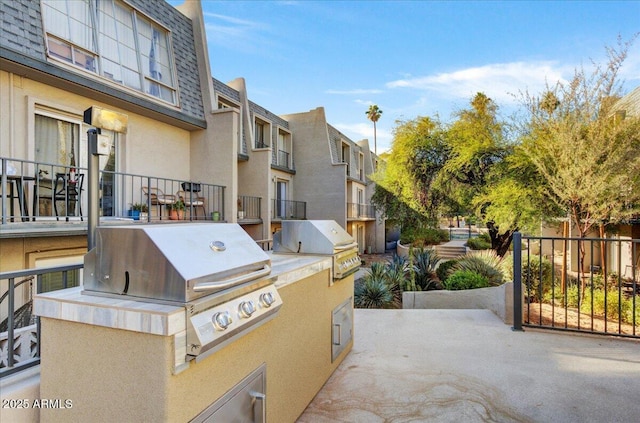 view of patio with a grill and an outdoor kitchen