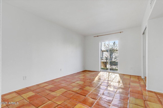 view of tiled spare room