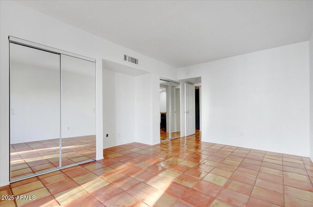 unfurnished bedroom with light tile patterned floors