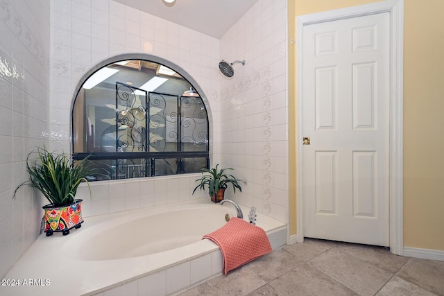 bathroom featuring tile patterned floors and shower with separate bathtub