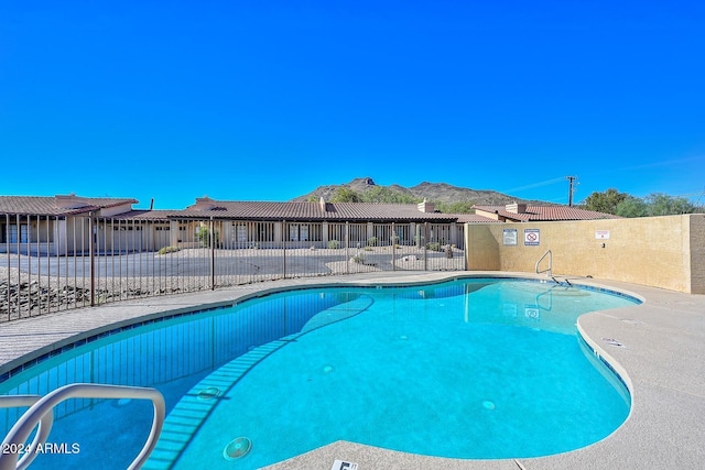 view of swimming pool featuring a mountain view