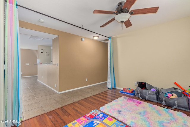 interior space featuring ceiling fan and light wood-type flooring