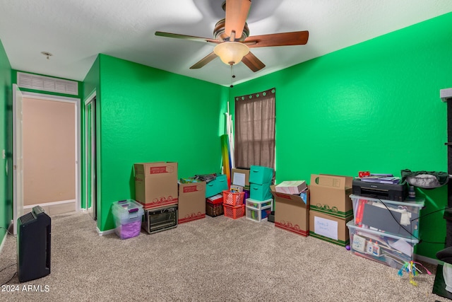 recreation room featuring ceiling fan and carpet floors