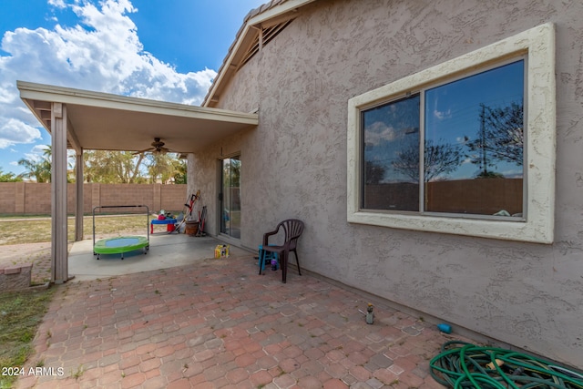 view of patio featuring ceiling fan