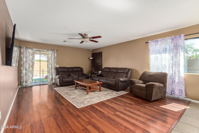 living room featuring ceiling fan and light wood-type flooring