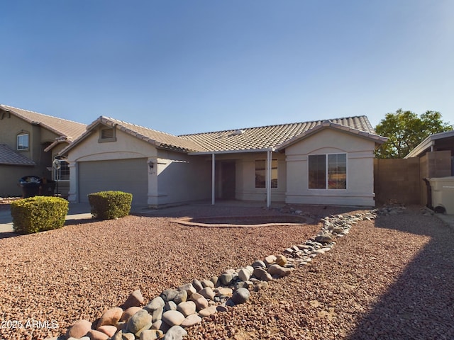 single story home featuring a garage