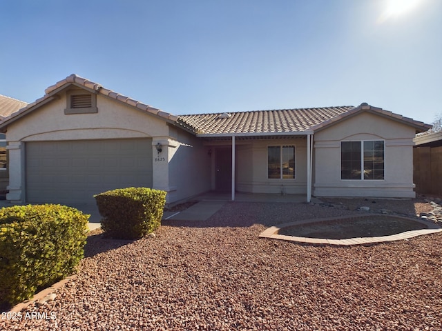 ranch-style house featuring a garage