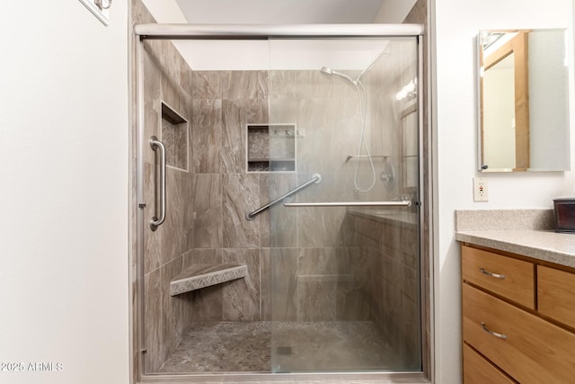 bathroom with vanity and an enclosed shower