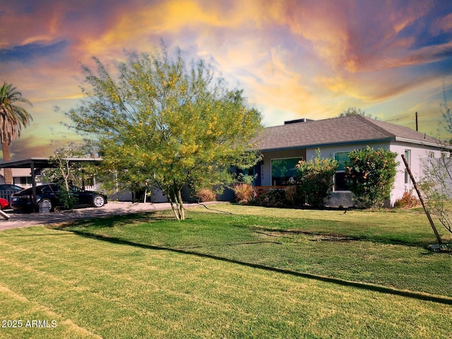 1702 W Glenrosa Ave, Phoenix, AZ 85015 - view of front of house with a front lawn, stucco siding, and a shingled roof