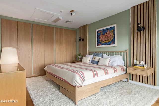 1702 W Glenrosa Ave, Phoenix, AZ 85015 - bedroom featuring attic access, a closet, and wood finished floors